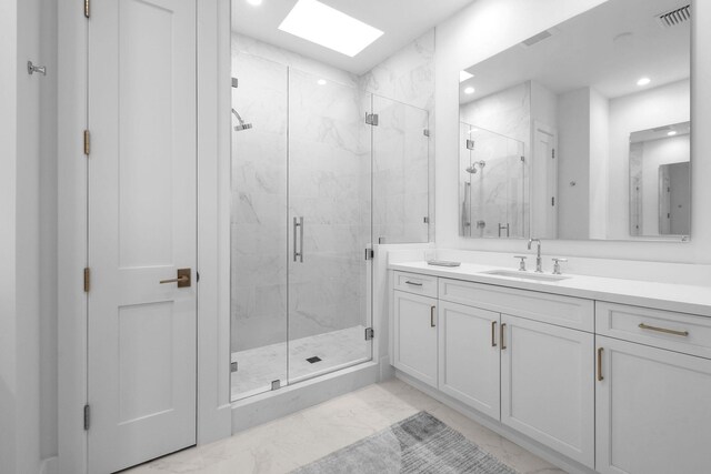 bathroom featuring marble finish floor, visible vents, vanity, and a marble finish shower