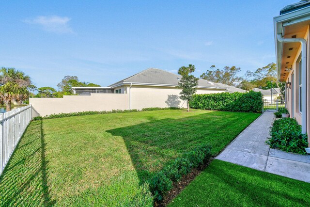 view of yard with a fenced backyard