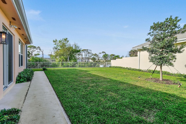 view of yard with a fenced backyard