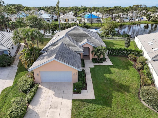 birds eye view of property with a residential view and a water view