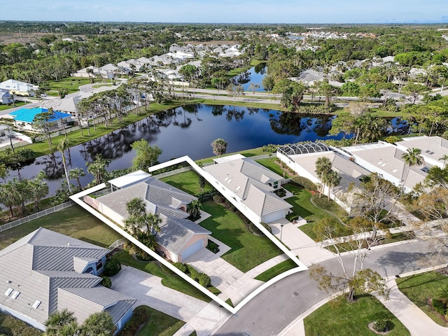 birds eye view of property featuring a water view and a residential view