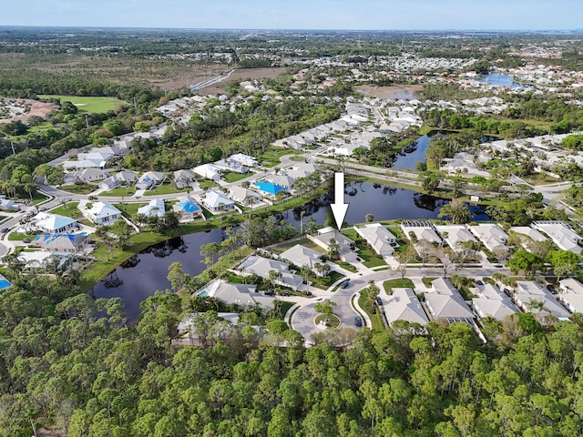 birds eye view of property featuring a residential view and a water view