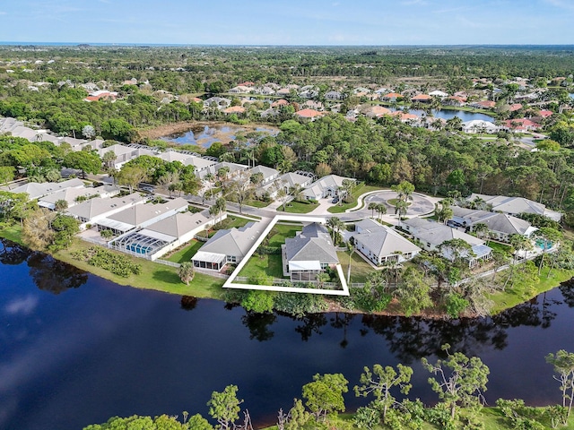 drone / aerial view featuring a water view and a residential view