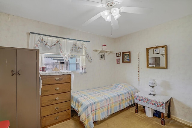 bedroom featuring ceiling fan and light colored carpet