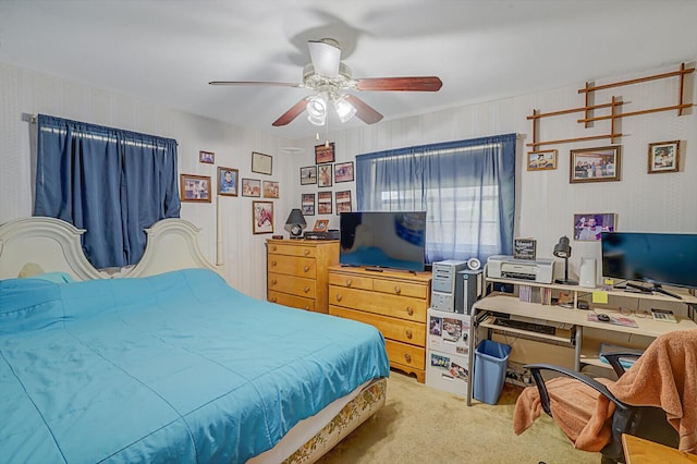 carpeted bedroom with a ceiling fan