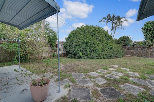 view of yard featuring a patio area and a fenced backyard