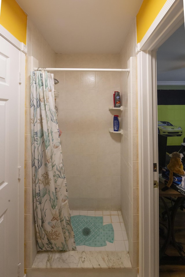 full bath with a tile shower