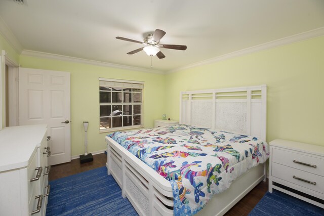 bedroom featuring dark wood-style floors, crown molding, baseboards, and ceiling fan