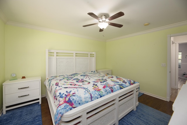 bedroom with ornamental molding, dark wood-type flooring, and baseboards