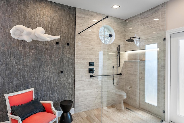 bathroom with toilet and tiled shower