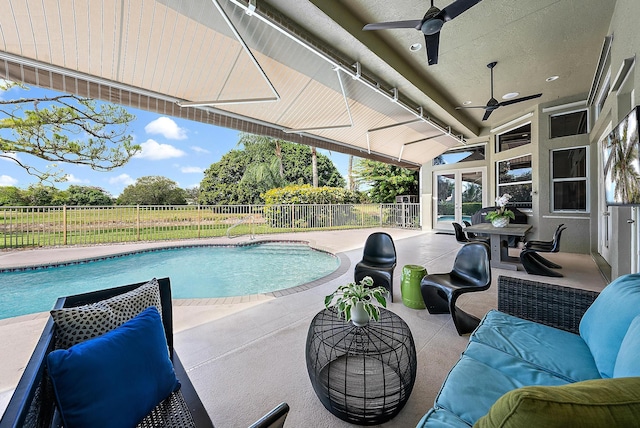 view of pool featuring a patio, a fenced backyard, a fenced in pool, and ceiling fan