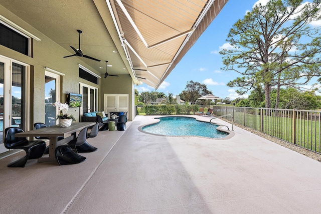 view of pool featuring a fenced in pool, a fenced backyard, a ceiling fan, and a patio area