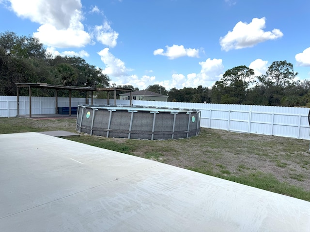 view of yard featuring a fenced in pool and a fenced backyard