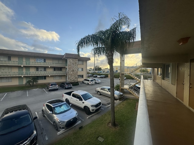 uncovered parking lot featuring stairway
