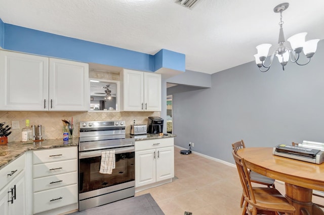 kitchen featuring light stone counters, electric range, baseboards, white cabinets, and tasteful backsplash