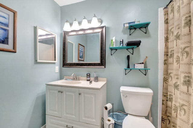 bathroom with vanity, toilet, and a shower with curtain