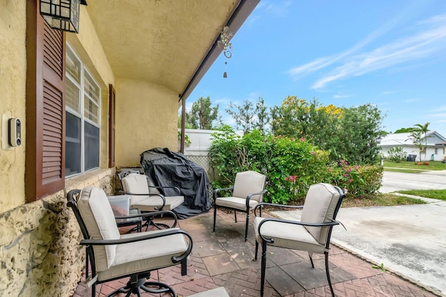 view of patio / terrace featuring fence and grilling area