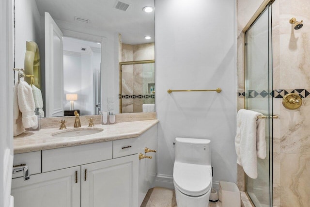 bathroom featuring toilet, vanity, visible vents, baseboards, and a shower stall