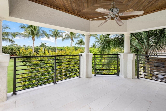 view of patio with a balcony and ceiling fan