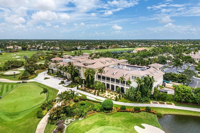 drone / aerial view featuring view of golf course and a water view