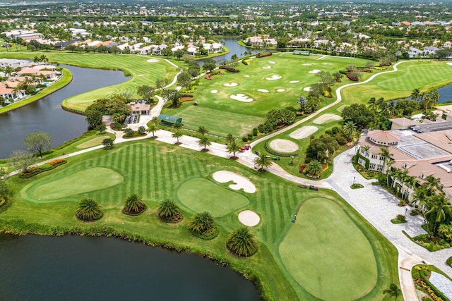 aerial view with view of golf course and a water view