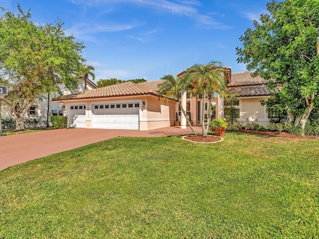 mediterranean / spanish home featuring a garage, concrete driveway, a tiled roof, stucco siding, and a front lawn