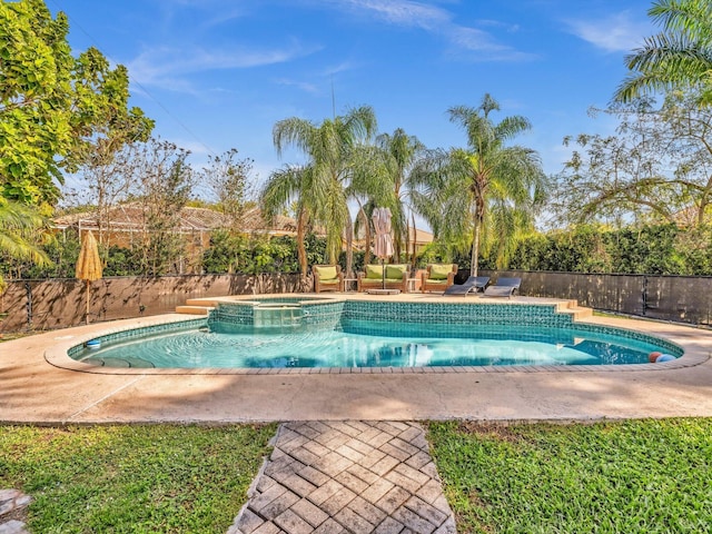 view of pool featuring a pool with connected hot tub, fence, and a patio