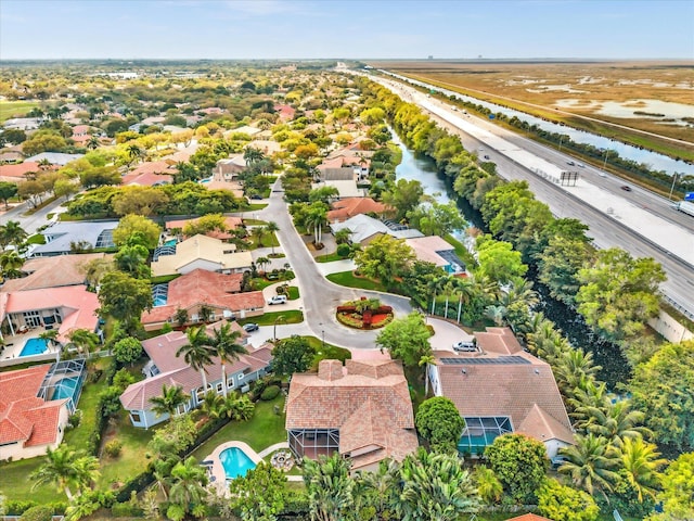 aerial view with a water view and a residential view