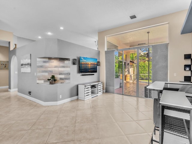 interior space with arched walkways, recessed lighting, visible vents, baseboards, and tile patterned floors