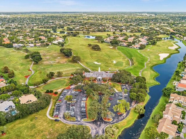 bird's eye view with a water view, a residential view, and golf course view