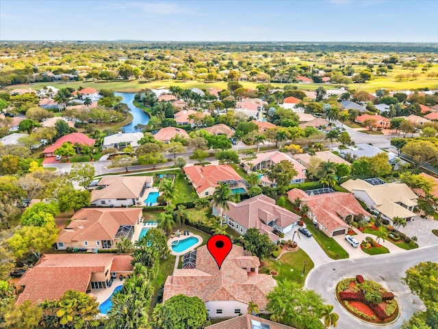 birds eye view of property featuring a residential view and a water view