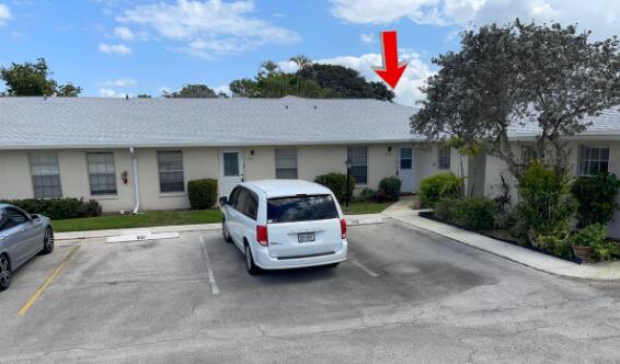 ranch-style home with uncovered parking