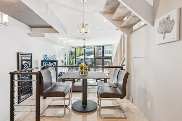 tiled dining room featuring stairs, recessed lighting, and expansive windows