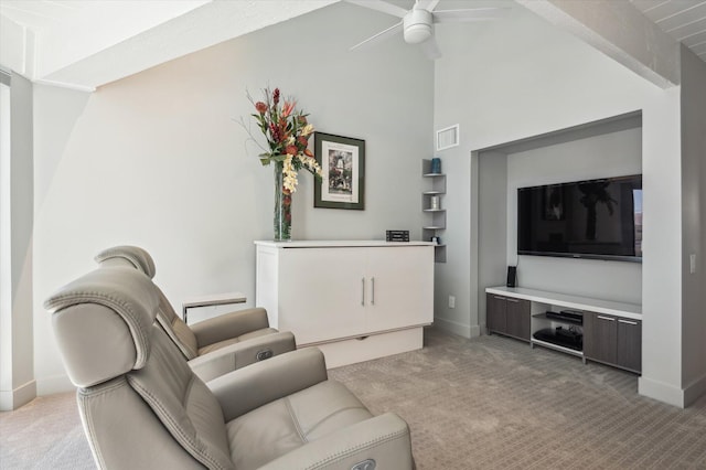 living room featuring visible vents, high vaulted ceiling, baseboards, light colored carpet, and ceiling fan