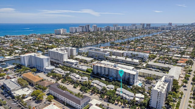 aerial view featuring a city view and a water view