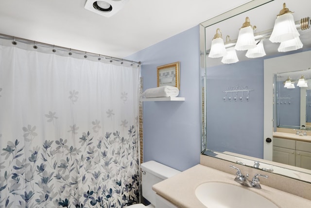 full bathroom with a shower with shower curtain, vanity, and toilet