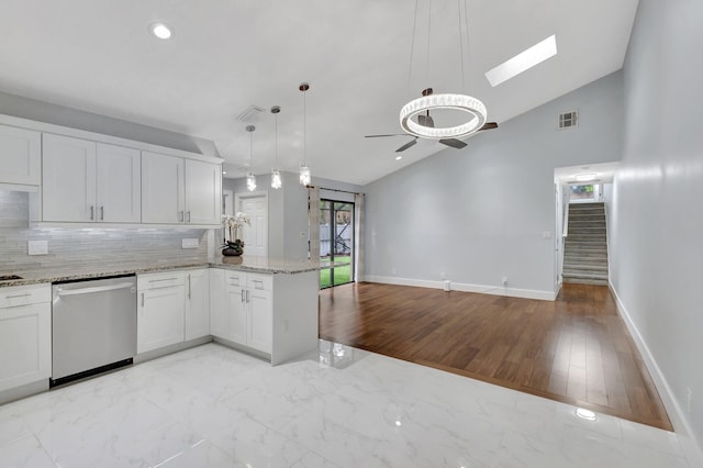 kitchen featuring a peninsula, visible vents, white cabinetry, marble finish floor, and stainless steel dishwasher