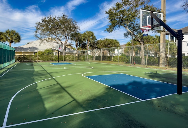 view of sport court featuring community basketball court and fence