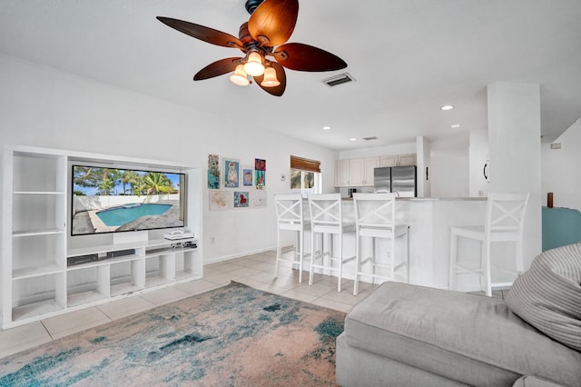 living room featuring light tile patterned floors, visible vents, baseboards, ceiling fan, and recessed lighting