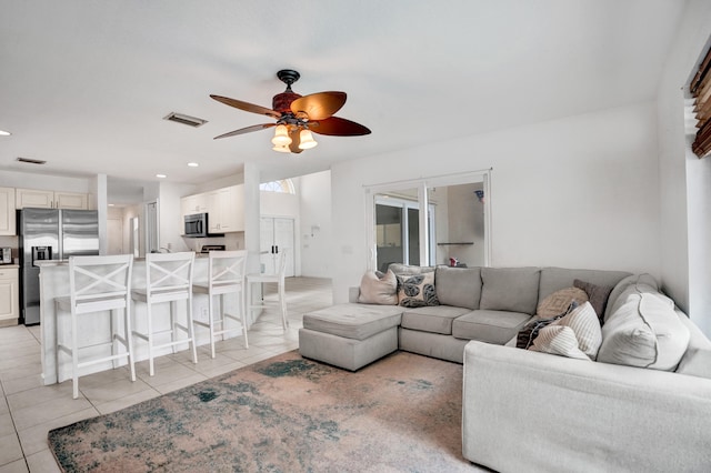 living room with recessed lighting, light tile patterned flooring, visible vents, and a ceiling fan