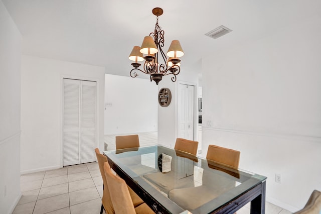 dining room with baseboards, visible vents, an inviting chandelier, and light tile patterned floors