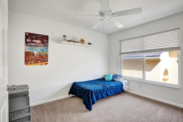 bedroom with carpet, baseboards, and ceiling fan