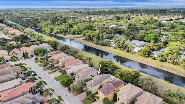 bird's eye view with a water view and a residential view