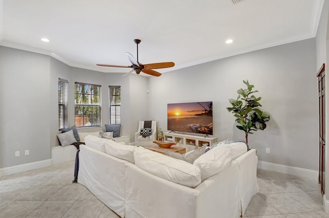 living room featuring recessed lighting, crown molding, baseboards, and light tile patterned floors