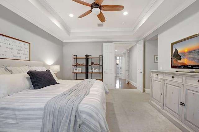 bedroom with recessed lighting, a raised ceiling, visible vents, and crown molding