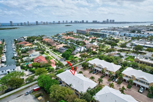 drone / aerial view with a view of city and a water view