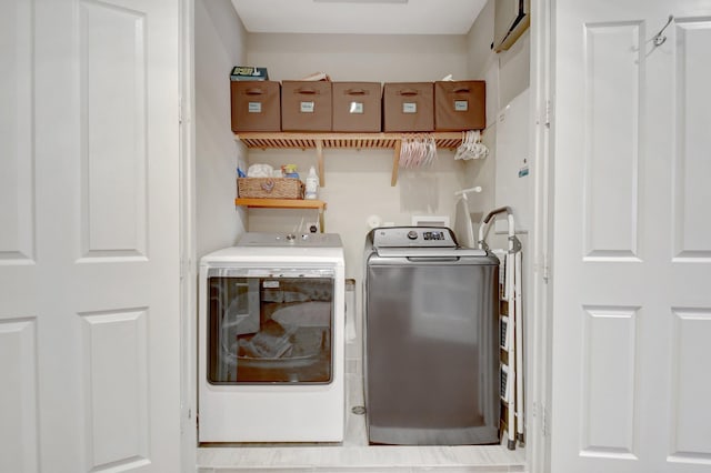 washroom with laundry area and independent washer and dryer