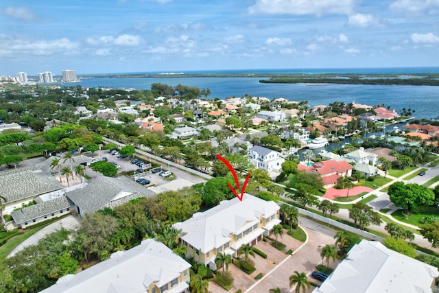 drone / aerial view featuring a water view and a residential view