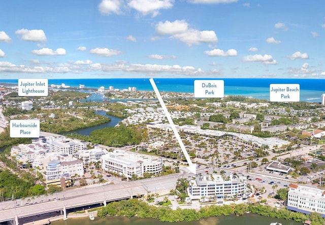 birds eye view of property featuring a water view and a city view