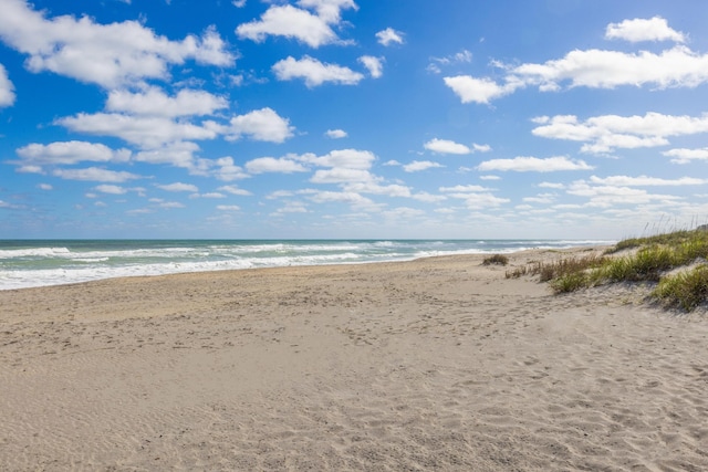 property view of water featuring a beach view